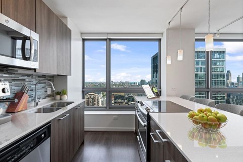 A modern kitchen with a view of the city.