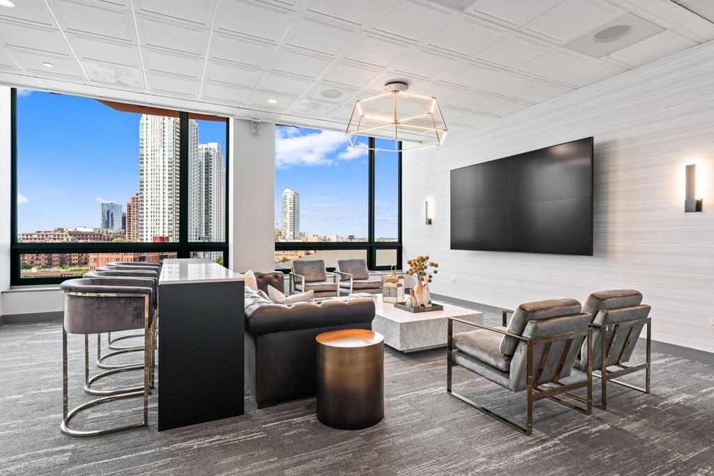 A modern living room with a large window overlooking a cityscape.