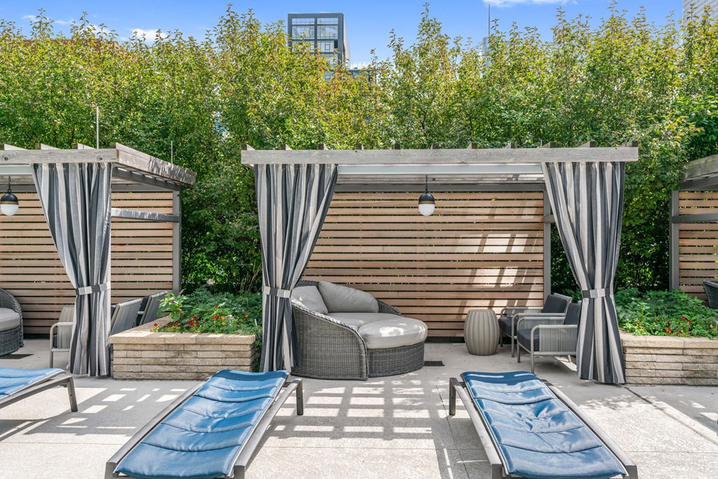A patio with a couch, chairs, and a slide.