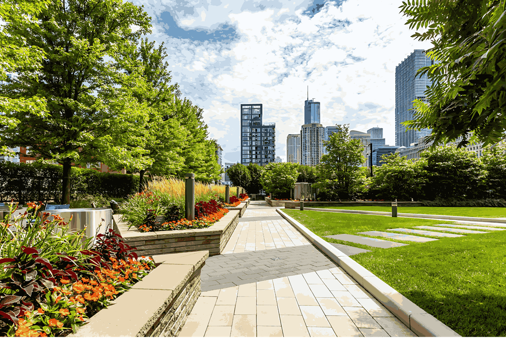 A walkway in a park with a city skyline in the background.