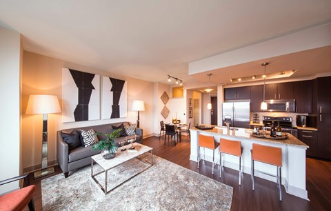 A modern living room with a grey couch and a coffee table.