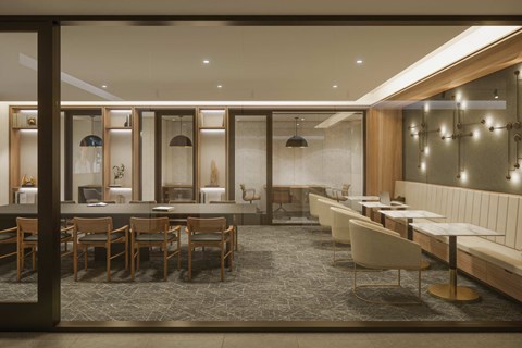 A modern dining area with wooden chairs and tables.
