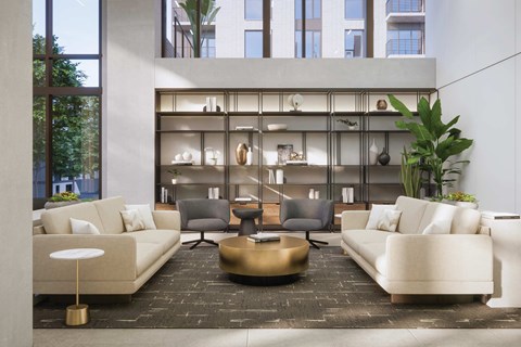 A modern living room with a large window and a coffee table in the center.