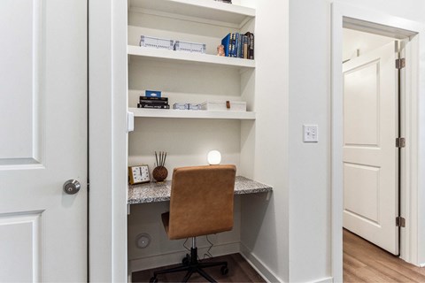 A small home office with a desk and chair.