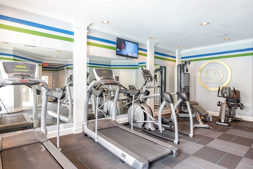 Monterey Village apartments for rent in Jonesboro, Georgia, featuring a gym with cardio equipment.