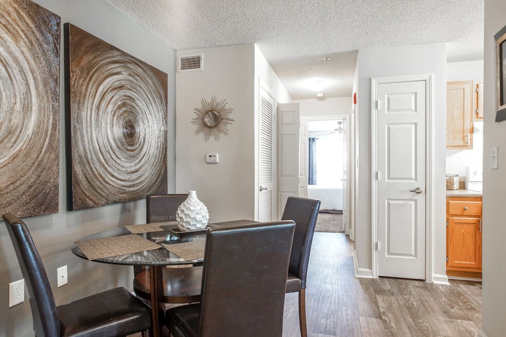 Dining room with hallway view at Monterey Village apartments for rent in Jonesboro, GA.