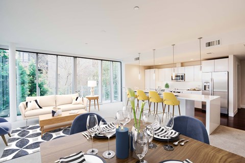 A modern dining room with a table set for a meal.