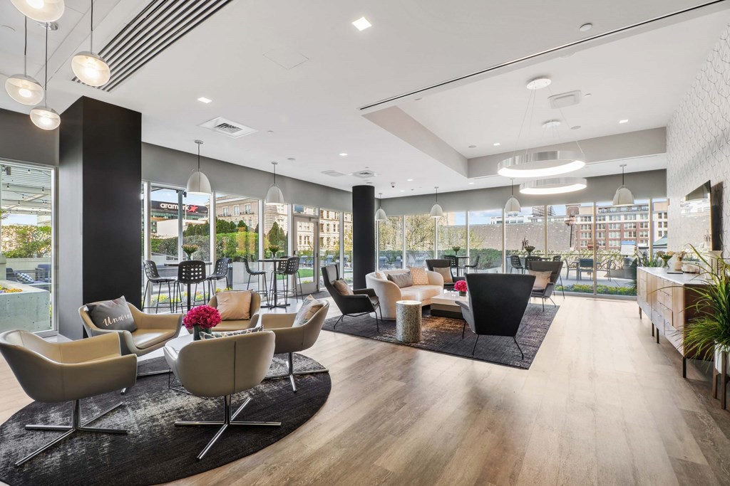 A modern living room with a large window and a view of the city.