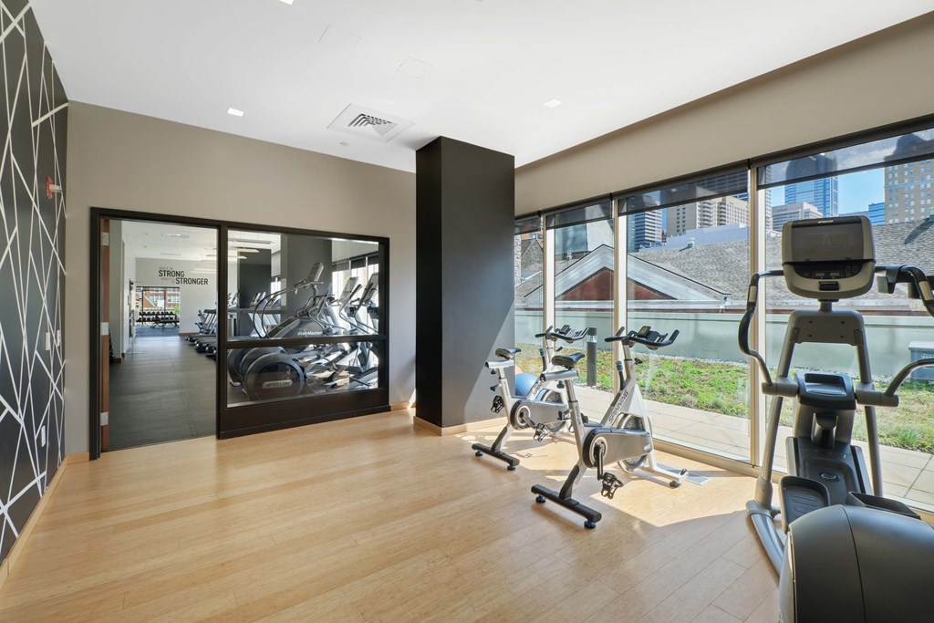 A gym with treadmills and exercise bikes.