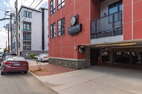 A red building with a sign that says Olde Stone.