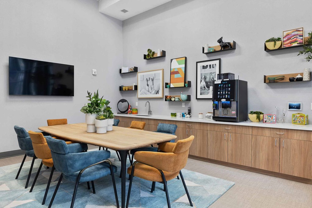 A modern dining room with a wooden table and chairs.