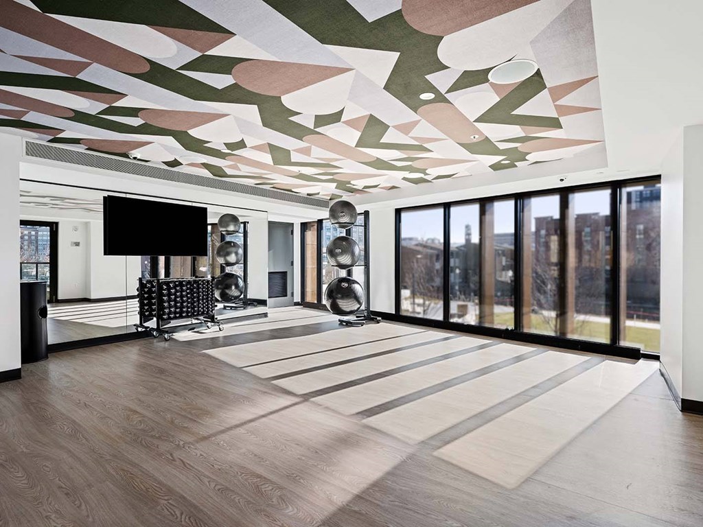 A modern room with a TV and a chair.