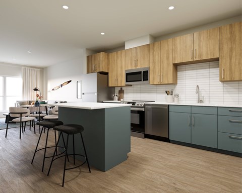 A kitchen with a bar area and a dining table.