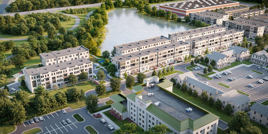 A bird's eye view of a residential area with a river running through it.