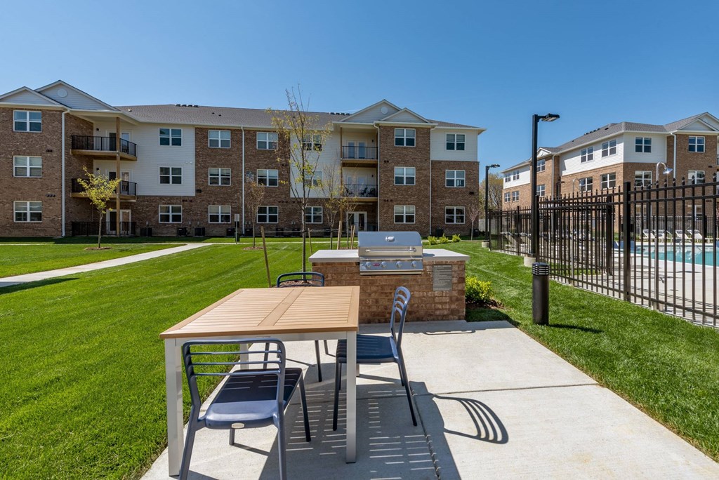 Outdoor grilling station surrounded by green space at Brandywine Green, Brandywine, MD