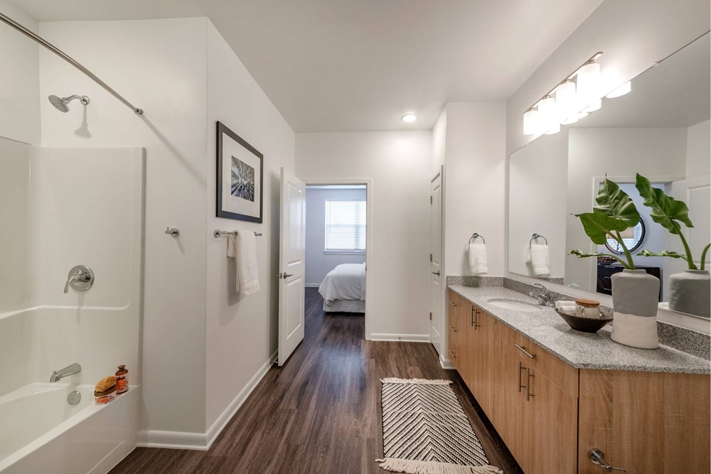 Elegant bathroom with dual sinks and under-the-counter storage at Brandywine Green, Maryland, 20613