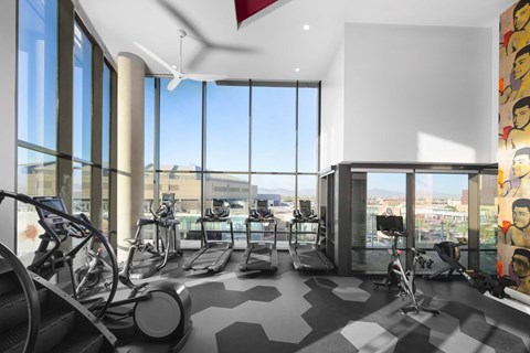 A gym with treadmills and exercise bikes.