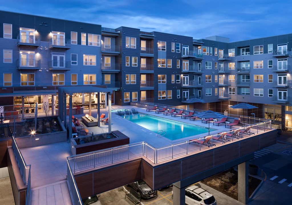 A large building with a pool in the middle of itt