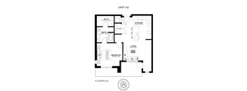 A black and white floor plan of Unit A2 showing a bedroom, bathroom, laundry, and kitchen.