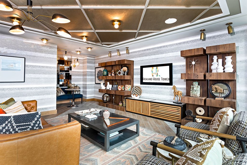 A living room with a brown sofa and a coffee table.
