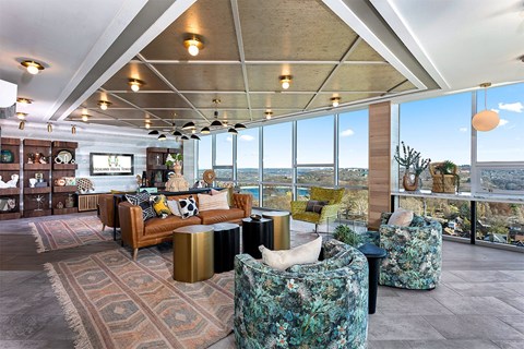 A living room with a view of the ocean.