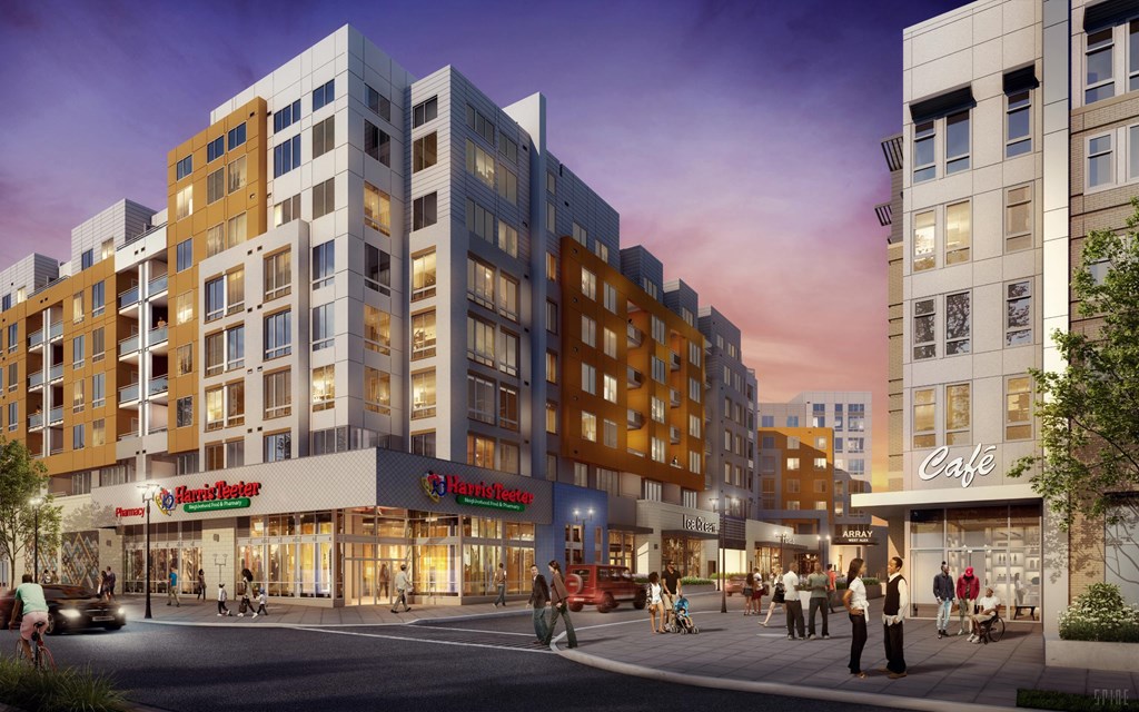 A modern apartment complex with a cafe and a bakery on the ground floor.