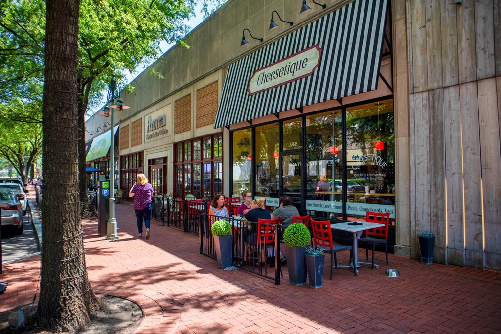 A restaurant with a red and white striped awning.