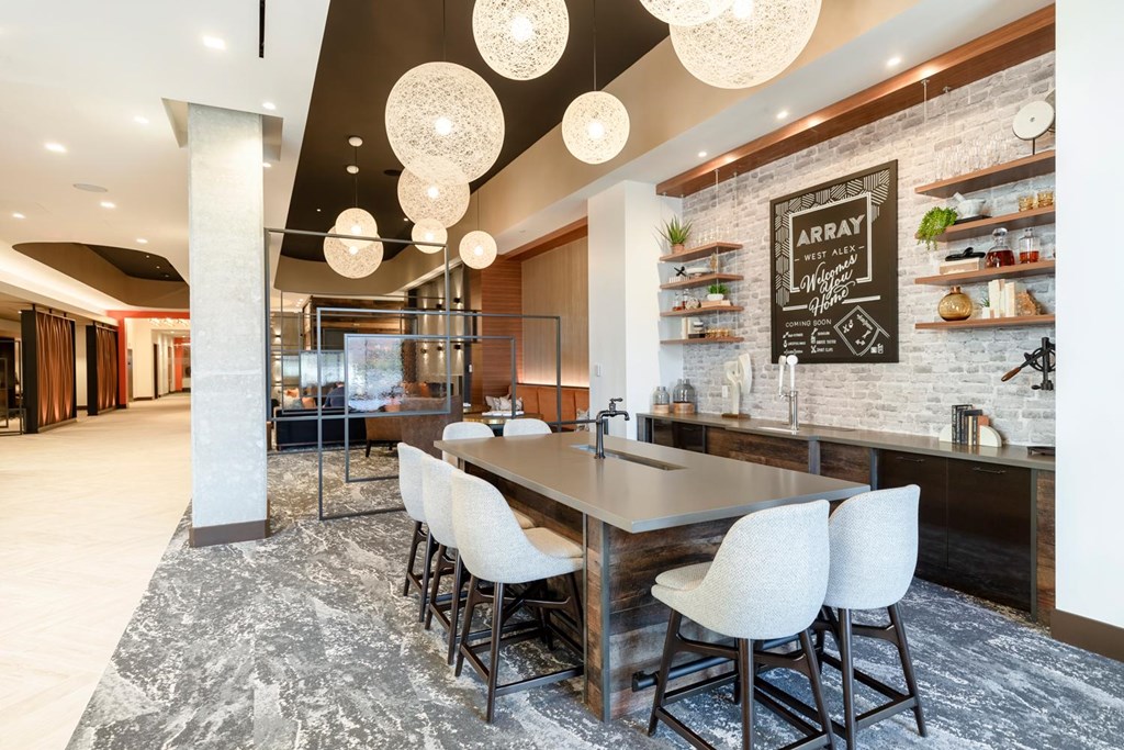 A modern kitchen with a dining table and chairs.