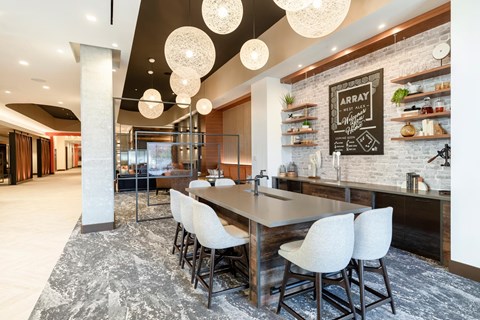 A modern kitchen with a dining table and chairs.