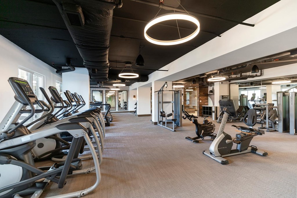 A gym with treadmills and exercise equipment.