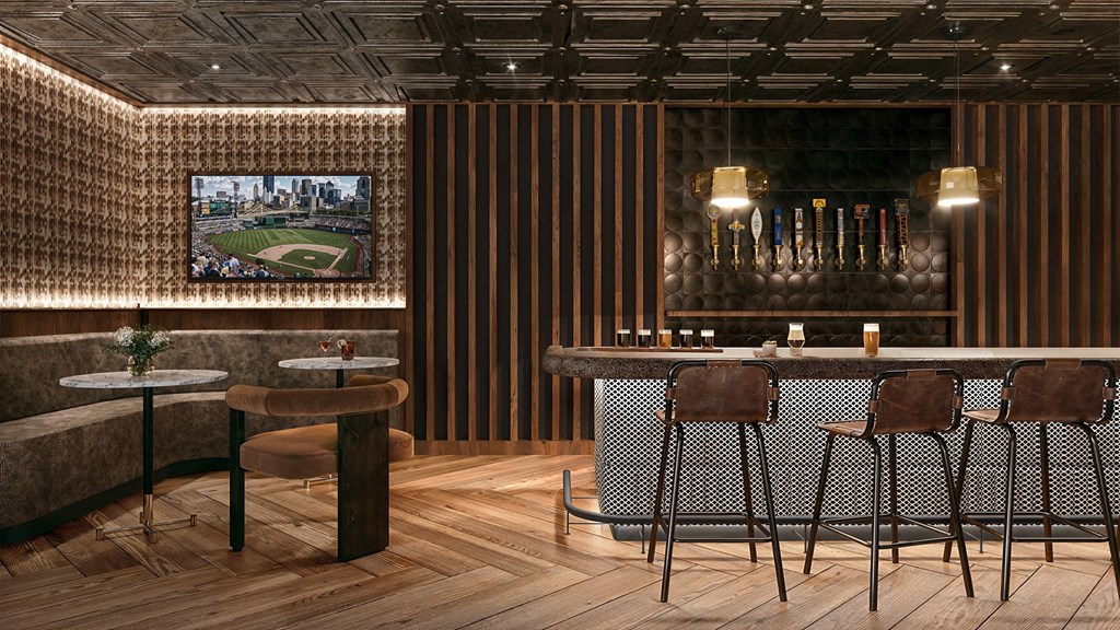 A bar area with a striped wall and a television screen showing a baseball game.