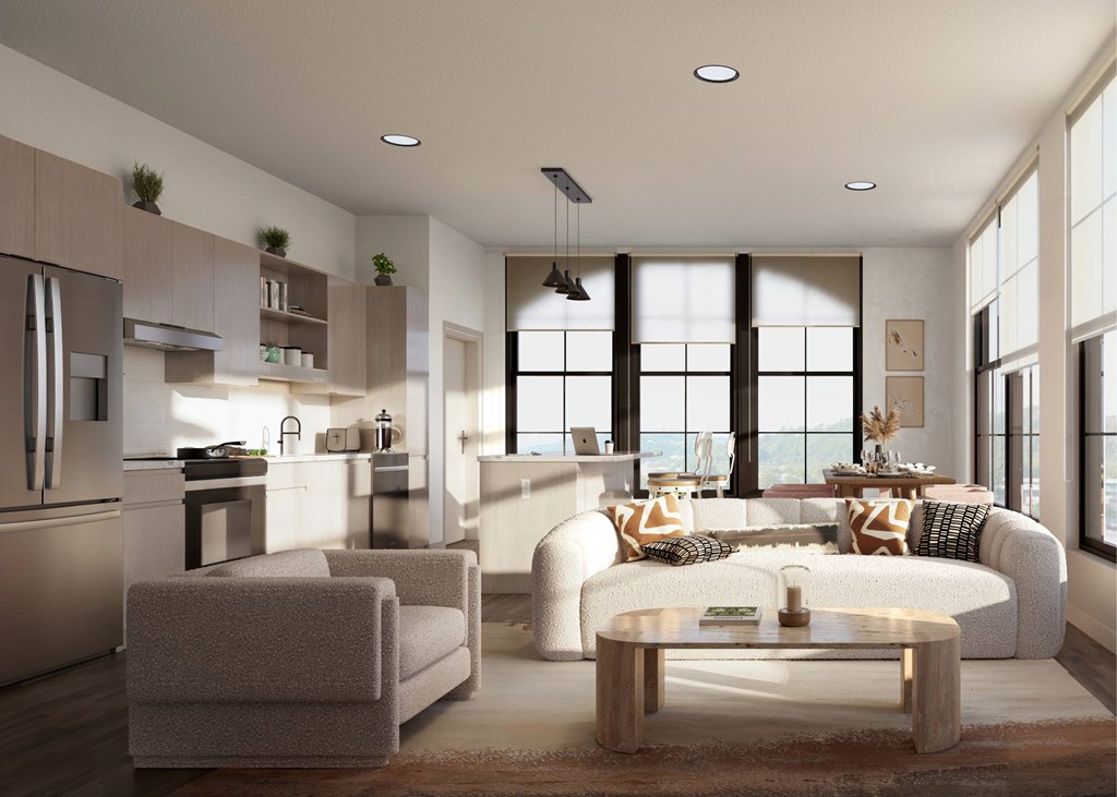A modern kitchen with a dining area and a living room.