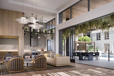 A modern living room with a large sofa, armchairs, and a dining area.