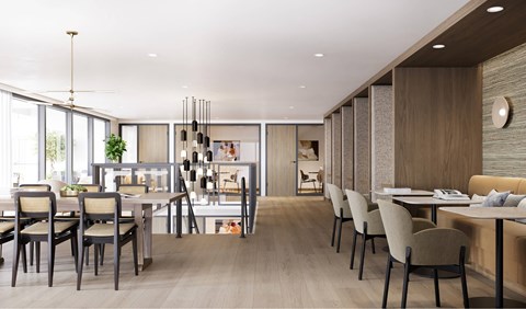 A modern dining room with a long table and chairs.