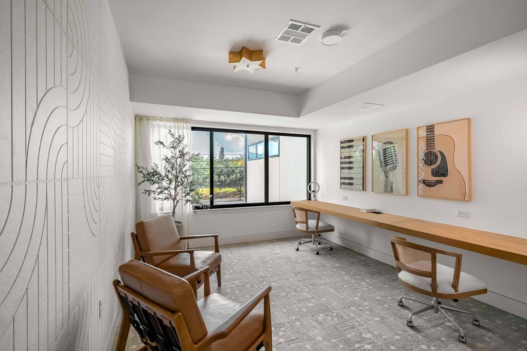 A room with a white wall and a wooden bench.