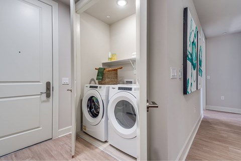 A laundry room with a washer and dryer.