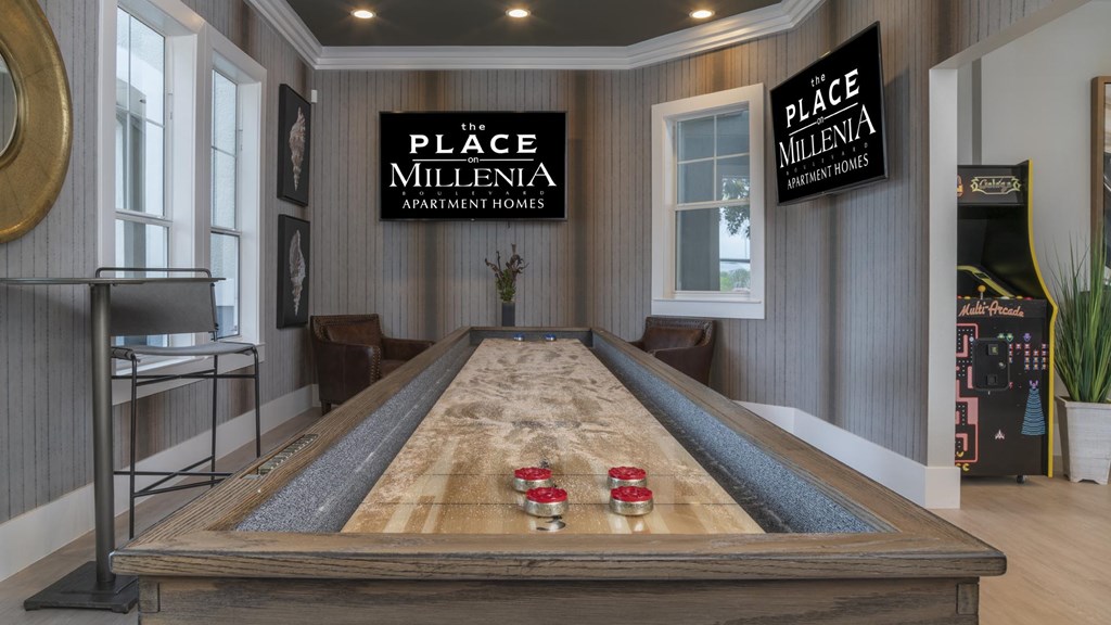 A shiny pool table with balls on it in a room.