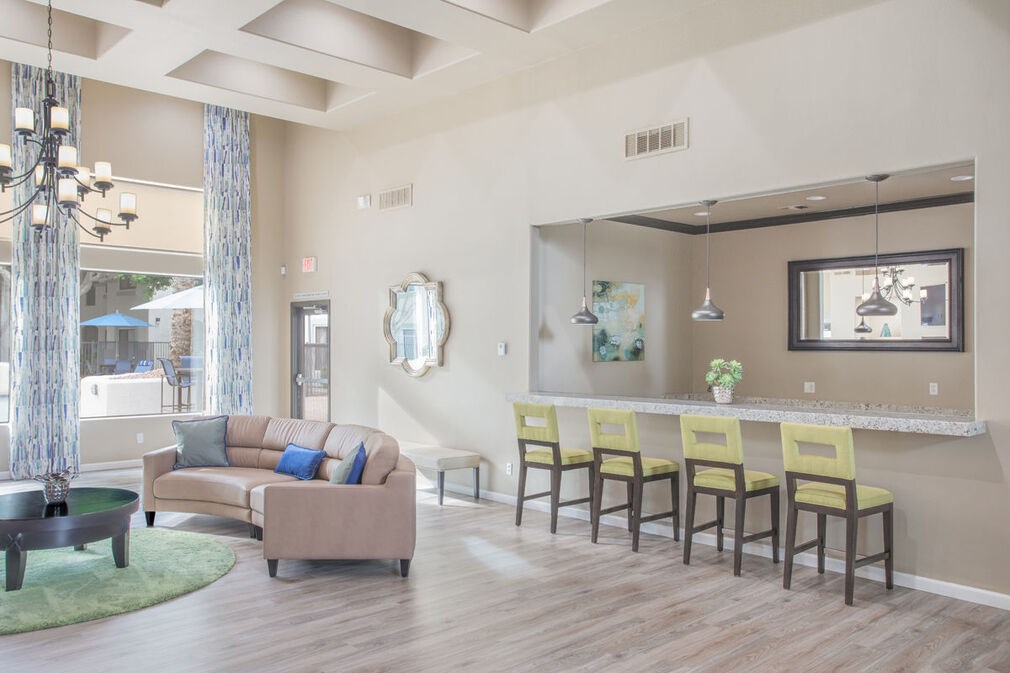 A living room with a sofa, chairs, and a coffee table.