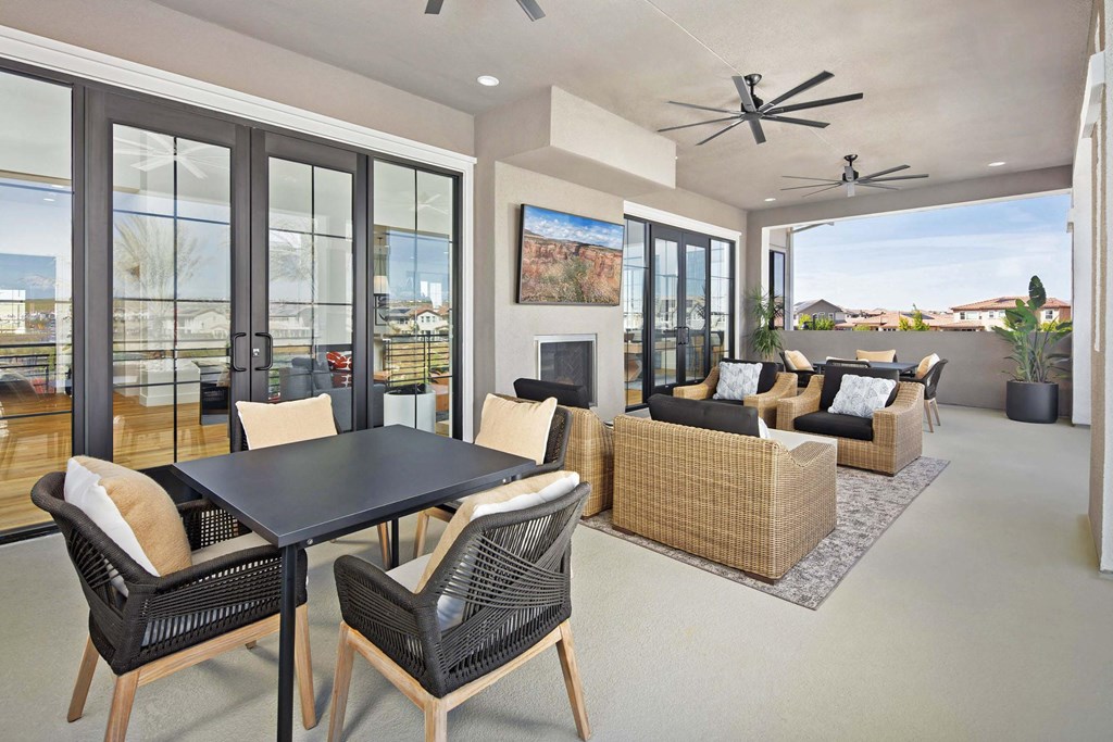 A modern patio with a table and chairs.