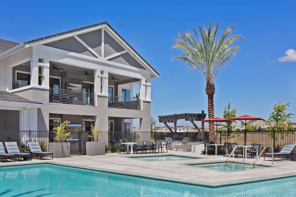 A modern house with a pool in the backyard.
