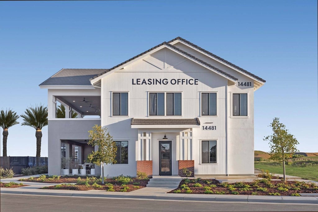 A modern building with the words "LEASING OFFICE" on the front.