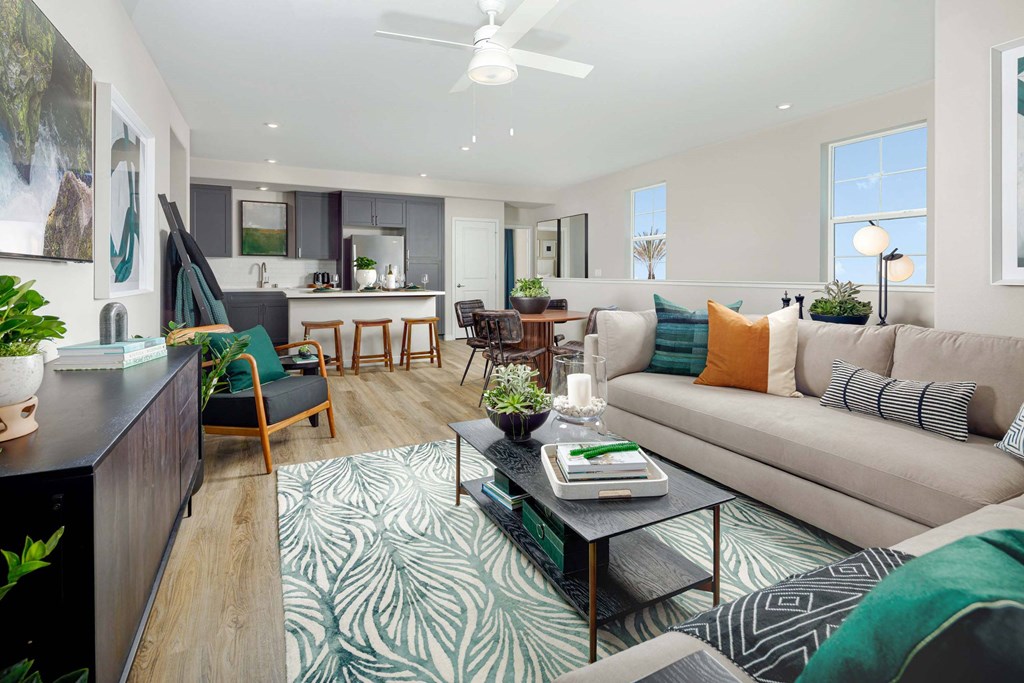 A living room with a couch, chairs, and a coffee table.
