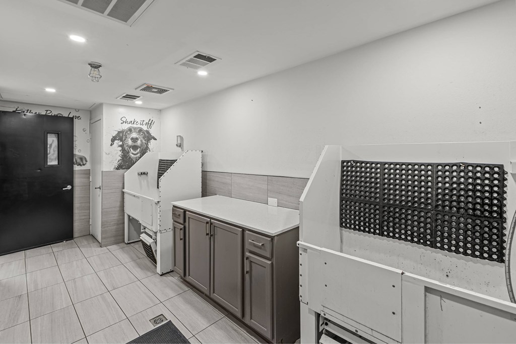 A black and white photo of a kitchen with a sign that says "Skate Stuff".