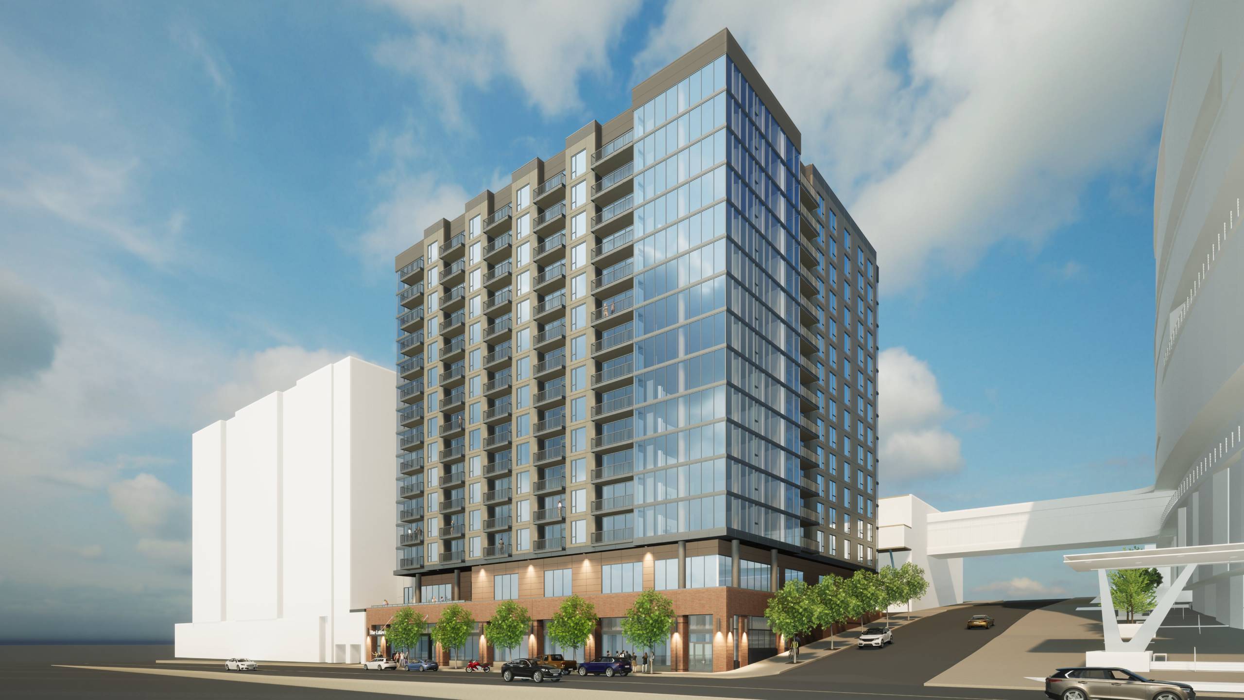A modern building with a glass facade is depicted in the image.