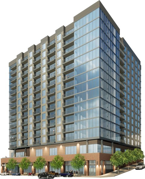 A modern multi-story building with a glass facade and a brown base.