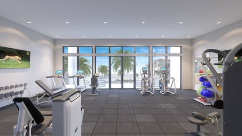 A gym with treadmills, exercise bikes, and dumbbells.