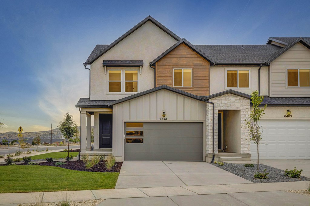 A modern house with a garage and a driveway.