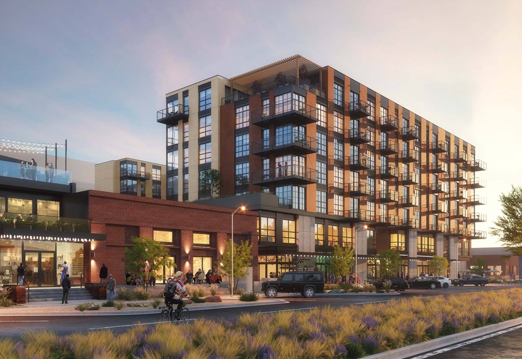 A modern multi-story building with balconies is depicted in the image.