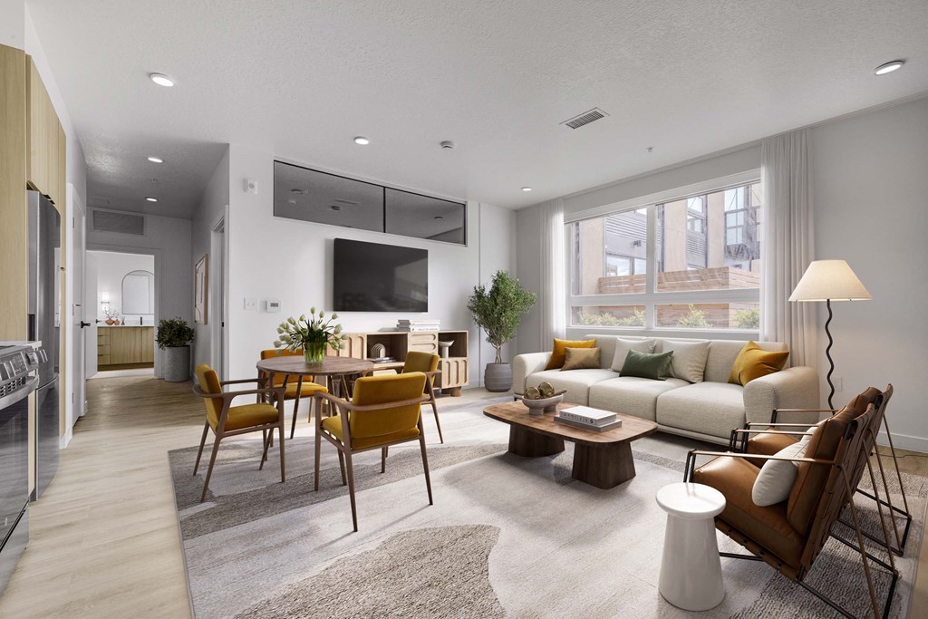 A modern living room with a wooden floor and furniture.