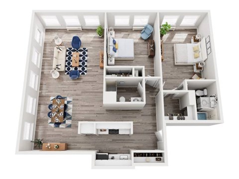 A top-down view of a modern apartment layout with a kitchen, living room, and bedroom.